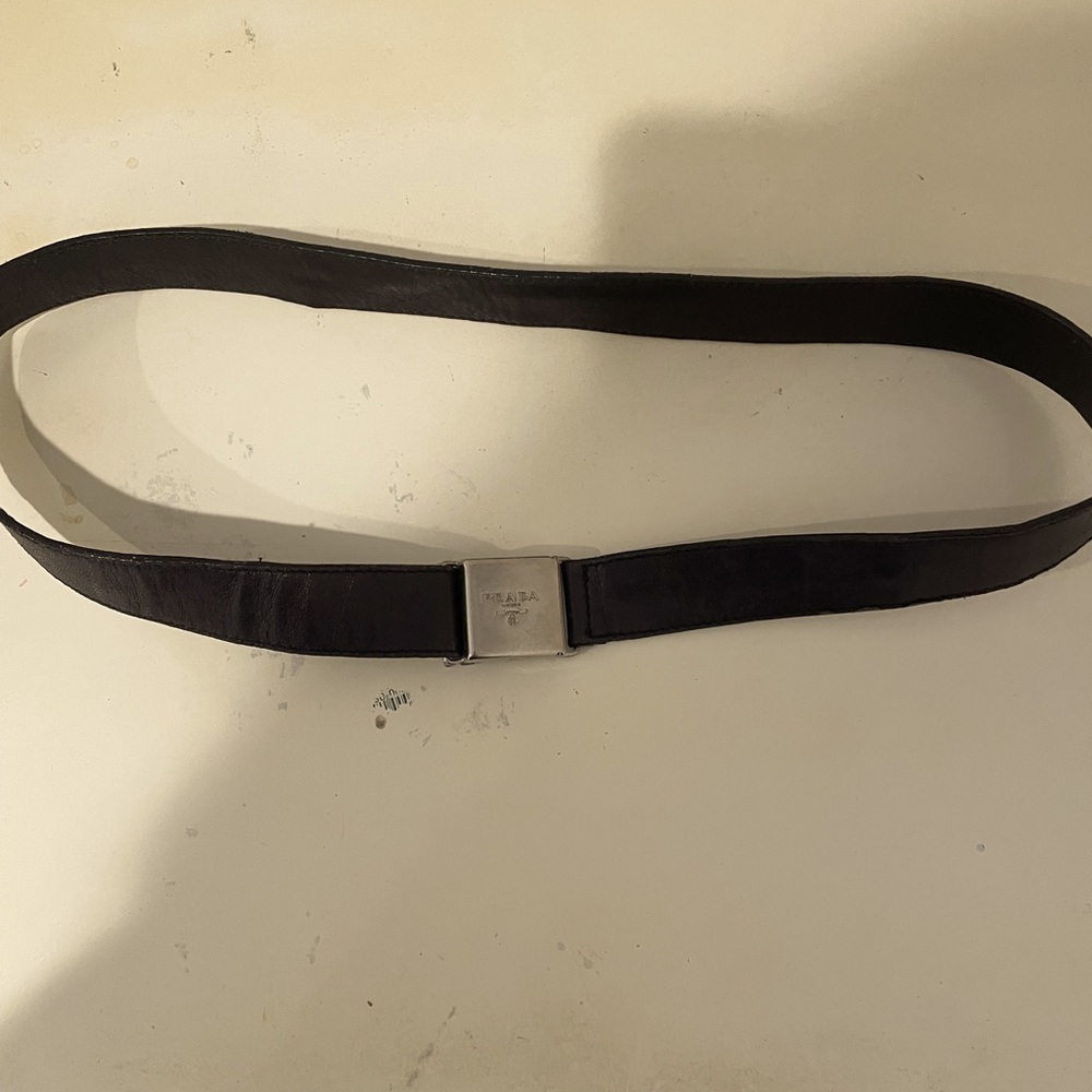Authentic Prada black leather belt with white gold hardware